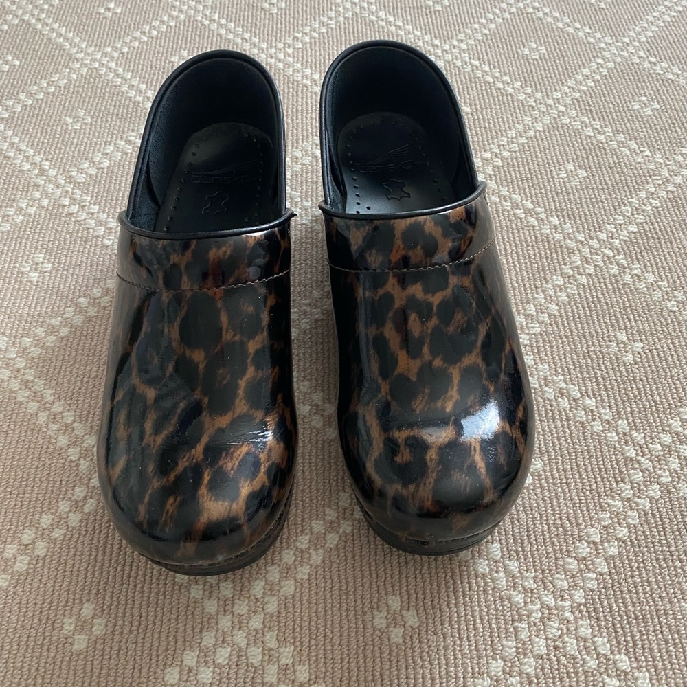 Dansko Leopard Print Patent Leather Clogs